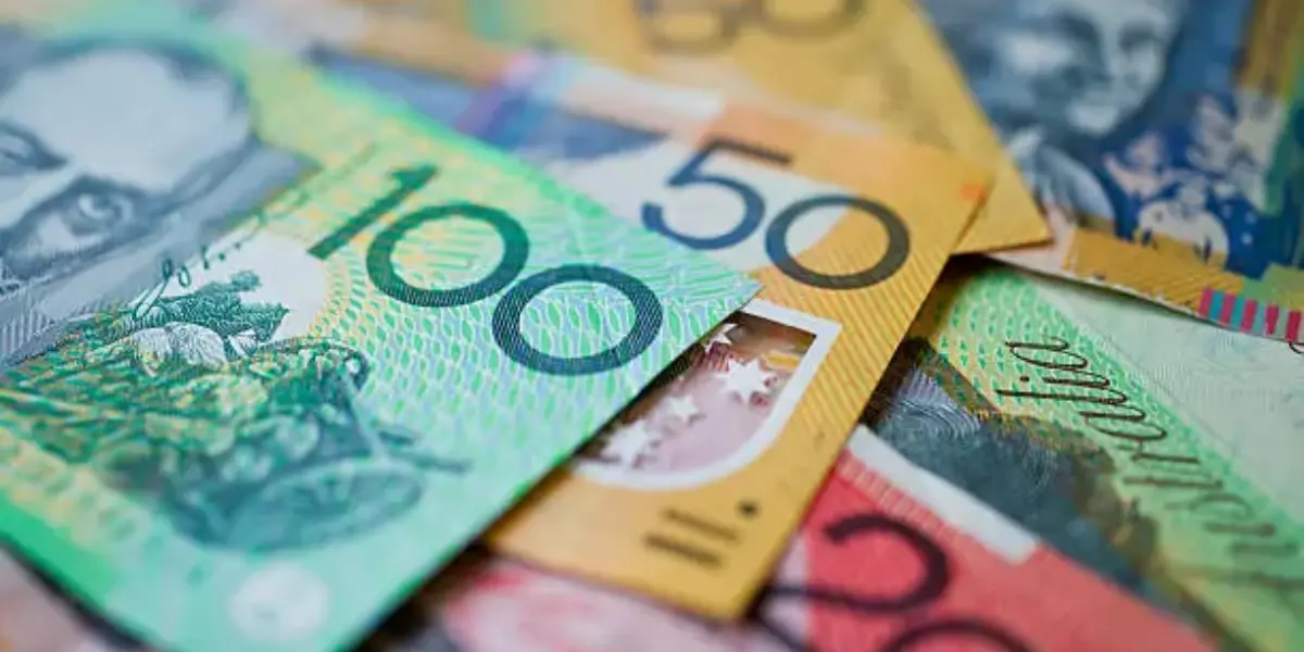 Australian dollar banknotes representing the cost of roof repairs and the importance of regular roof maintenance
