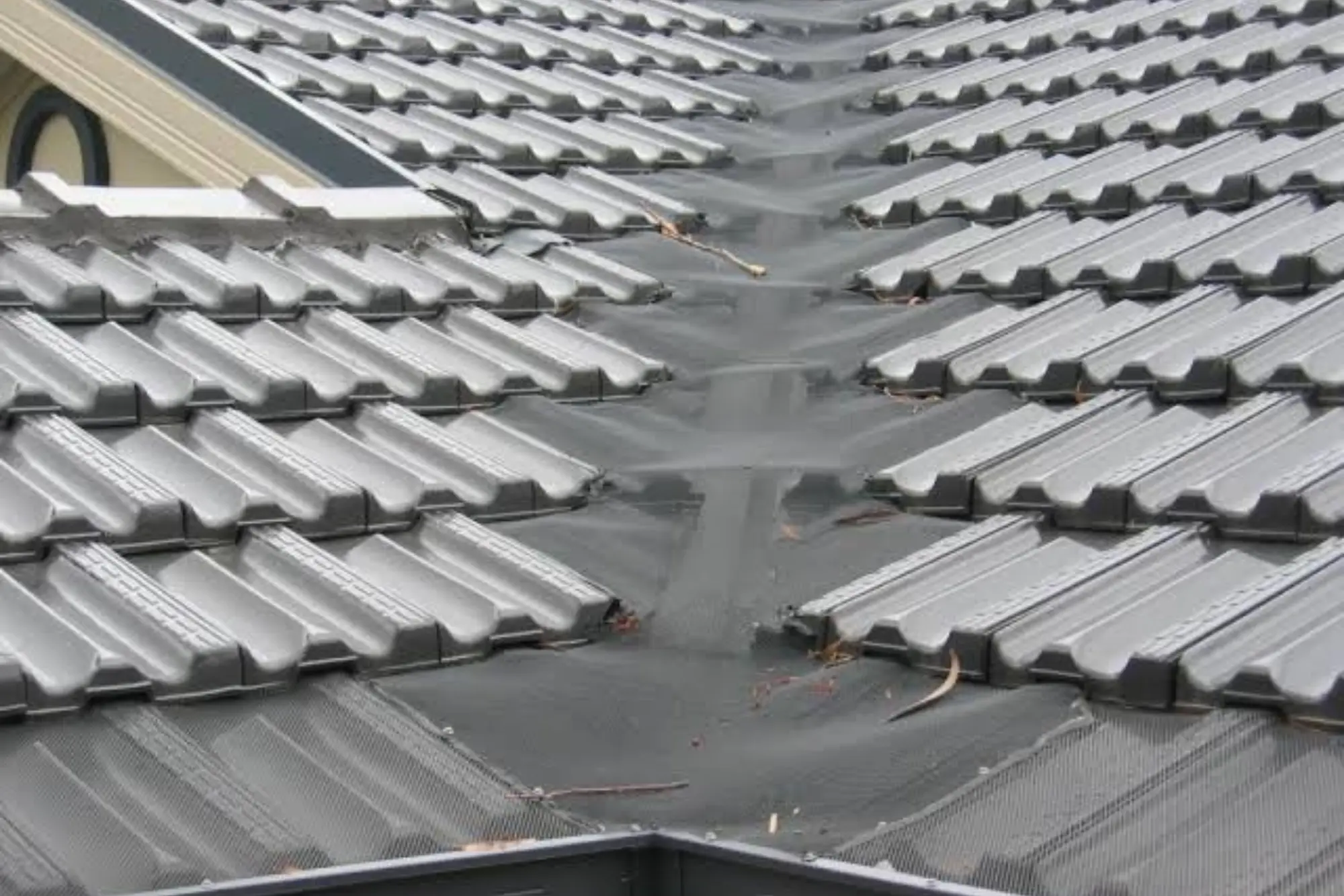 Gutter guards in Sydney – mesh installed over roof valley and gutter on a concrete tile roof